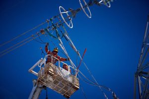 Power line technicians working on a Bipole tower.