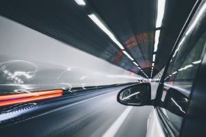 A car in traveling through a tunnel.