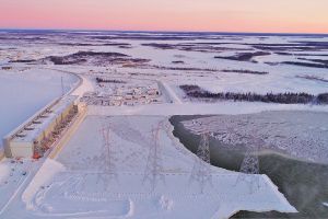 Arial view of the Keeyask Generating Station in winter covered in snow and ice.