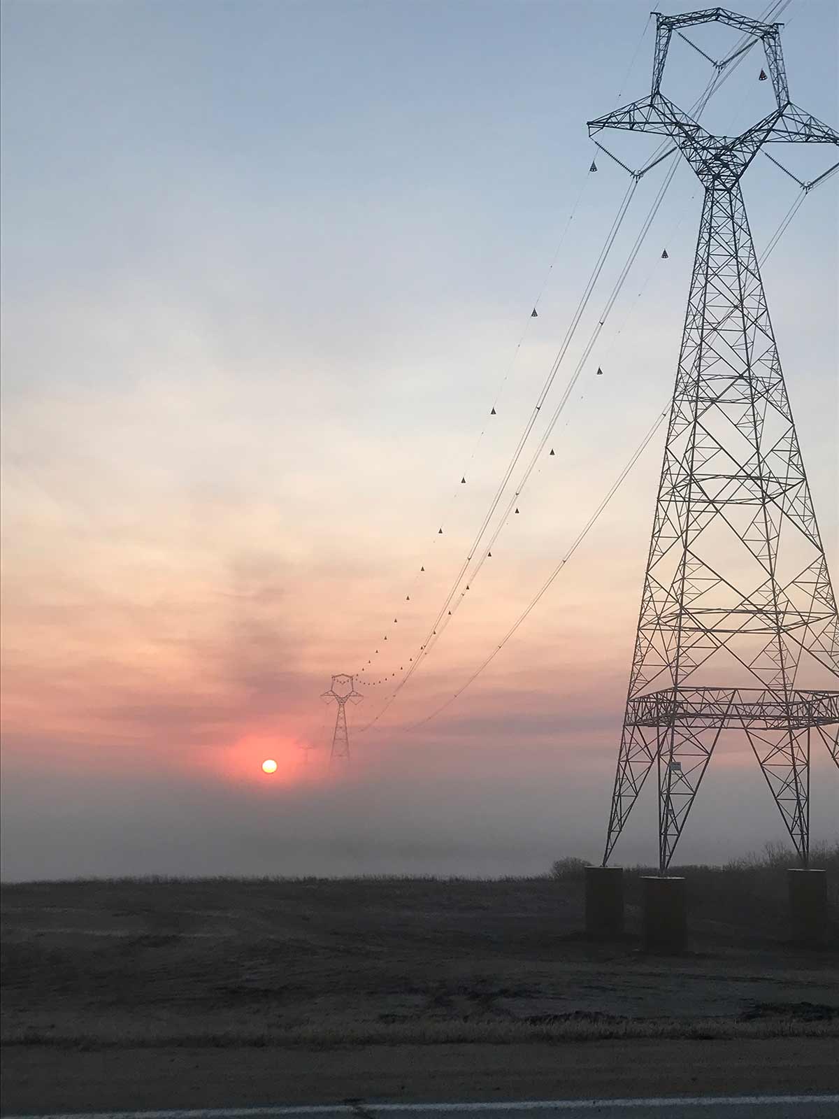 Foggy sun through towers.